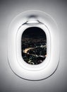 Night city at airplane window Royalty Free Stock Photo