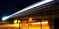 Night city, blue hour, panorama view from under the bridge with a bright light traces of traffic. Royalty Free Stock Photo