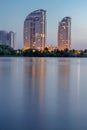 Night city buildings reflected in river water. HDR Royalty Free Stock Photo