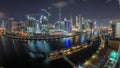 Night city Dubai near canal with bright skyscrapers aerial timelapse Royalty Free Stock Photo