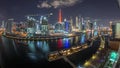 Night city Dubai near canal with bright skyscrapers aerial timelapse Royalty Free Stock Photo