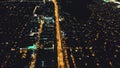 Night city life: illuminated streets, roads aerial. Nightlife of Philippines metropolis town Manila