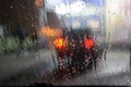 Wet window with the background of night city traffic view. Royalty Free Stock Photo