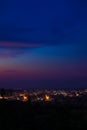 Night city light colorful blurry illumination after sunset time dusk vertical background concept photography