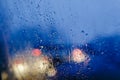 Night city lights through windshield abstract background water drop on the glass lights and rain Royalty Free Stock Photo