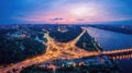 Night city panorama of the Kiev city with the Paton Bridge and the Dnieper River. Ukraine