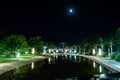 Night city park with a river and beautiful lights in summer Royalty Free Stock Photo