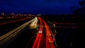 Night city road in Germany with blurred light tracks from cars Royalty Free Stock Photo