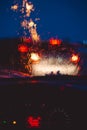 Night city road through windshield cars abstract background water drop on the glass lights and rain Royalty Free Stock Photo