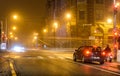 Night city, roadway , cars and motorbikes are the traffic lights Royalty Free Stock Photo