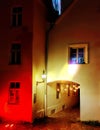 Night city streets medieval house blurred light on windows reflection blue red yellow  Old town of Tallinn Estonia Royalty Free Stock Photo