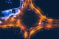 Night city traffic on circle intersection. Aerial top down view from drone Royalty Free Stock Photo