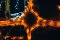 Night city traffic on circle intersection in Paphos, Cyprus. Aerial top down view from drone Royalty Free Stock Photo