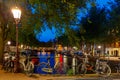 Night city view of Amsterdam canal and bridge Royalty Free Stock Photo