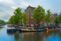 Night city view of Amsterdam canal and bridge Royalty Free Stock Photo