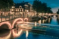 Night city view of Amsterdam canal and bridge Royalty Free Stock Photo