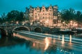 Night city view of Amsterdam canal and bridge Royalty Free Stock Photo