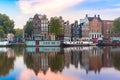 Night city view of Amsterdam canal with dutch houses