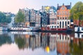 Night city view of Amsterdam canal with dutch houses