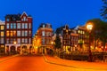 Night city view of Amsterdam canal with dutch houses Royalty Free Stock Photo