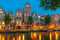 Night city view of Amsterdam canal with dutch houses Royalty Free Stock Photo