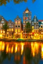 Night city view of Amsterdam canal with dutch houses Royalty Free Stock Photo