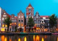 Night city view of Amsterdam canal with dutch houses Royalty Free Stock Photo