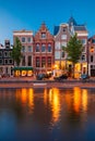 Night city view of Amsterdam canal with dutch houses Royalty Free Stock Photo