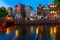 Night city view of Amsterdam canal with dutch houses Royalty Free Stock Photo