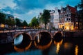 Night city view of Amsterdam canal Herengracht, typical dutch houses in evening dusk lights, Holland, Netherlands Royalty Free Stock Photo