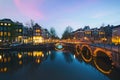 Night city view in Amsterdam, Netherlands. Canal and typical dutch houses at night in Amsterdam, Netherlands Royalty Free Stock Photo