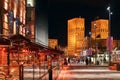 Night city view of Oslo, Norway at Aker Brygge Dock with restaurants and City Hall or Radhuset on background. Royalty Free Stock Photo