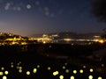 Night city view. Volos city lights upon the Pagasetic Gulf. Greece.