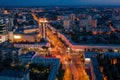 Night City Voronezh downtown or center panorama from above with illuminated road intersection, car traffic, aerial view