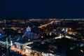 Night City Voronezh downtown or center panorama from above with illuminated road intersection, car traffic, modern