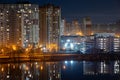 Night cityscape of the big city. Bright, multi colored light on empty streets. Apartment buildings in bedroom town area. Kyiv in Royalty Free Stock Photo