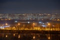 Night cityscape of the big city. Bright, multi colored light on empty streets. Apartment buildings in bedroom town area. Kyiv in Royalty Free Stock Photo