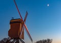 Night cityscape of Bruges city with Sint-Janshuis Mill against night blue sky