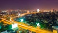 Night cityscape with golden highway.