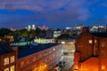 Night cityscape of London with train light trails and traditional living building on foreground and downtown skyline on background Royalty Free Stock Photo