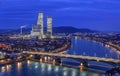 Night cityscape of the Swiss city Basel over the Rhine river with street lights