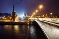 Night cityscape view of Moscow Kremlin, Basil`s Descent and Red Square, embankment, street lights at evening winter snowfall. Royalty Free Stock Photo