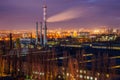 Night cityscape view of Voronezh. Industrial area, pipes of factory are polluting air Royalty Free Stock Photo