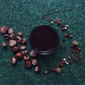 Night Coffee flatlay with chestnuts, acorn and fantasy berries forrest necklage