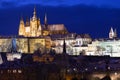 Night colorful snowy Christmas Prague Lesser Town with gothic Castle with Charles Bridge, Czech republic Royalty Free Stock Photo