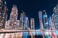 colorful view of the famous tourist attraction of the city of Dubai - Marina seaport and illuminated skyscrapers. Travel and Royalty Free Stock Photo