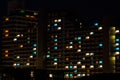 Night colorful windows lights in residential building