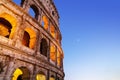 Night Colosseum photo with bright lighted arches.