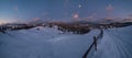 Night countryside hills, groves and farmlands in winter remote alpine mountain village. Ukraine, Voronenko