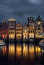 Night dancing houses at Amsterdam canal Damrak, Netherlands Royalty Free Stock Photo